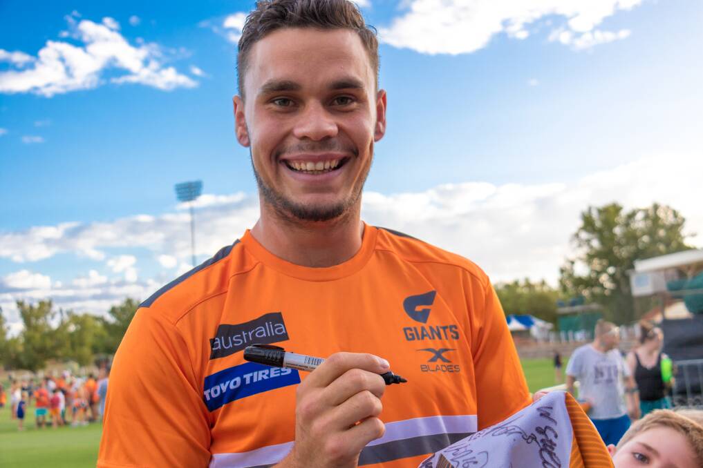 HAPPY DAYS: Narrandera's own Zac Williams is greeted by fans on Friday night to the news he has re-signed with the Giants. Picture: GWS Giants