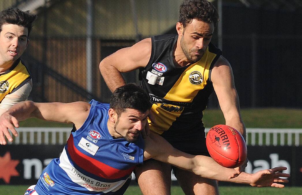 DESPERATION: Turvey Park's James Colaicovo races Wagga Tigers' Jesse Manton to the ball at Robertson Oval on Saturday. Picture: Laura Hardwick