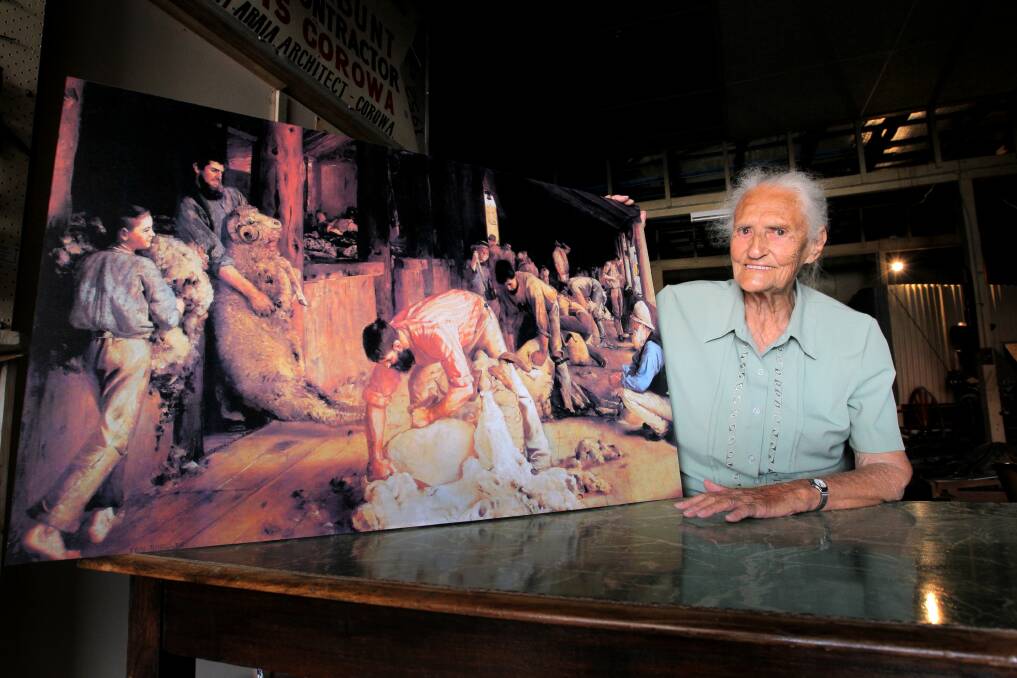 Dorothy Ambrose with a copy of the Tom Roberts painting Shearing the Rams in which her grandmother Susan Bourne was painted as the Tar Boy. Picture: DAVID THORPE
