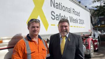 Divall's Earthmoving and Bulk Haulage truck driver, McKinley Somner with National Road Safety Week founder, Peter Frazer, at the Goulburn launch of National Road Safety Week. Picture by Louise Thrower.