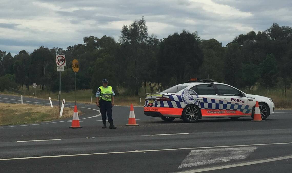 Police block motorists from seeing the scene of the crash.