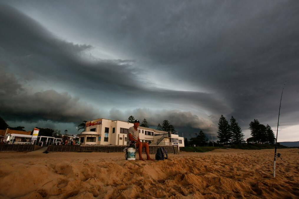 The storm passes over North Wollongong beach. Picture: Adam McLean
