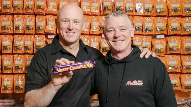 Robern Menz CEO Phil Sims, left, with Richard Sims, said: "As the new gatekeeper of Violet Crumble, we are aware of the responsibility that comes along with owning a brand so highly regarded in the Australian market place." Photo: Supplied