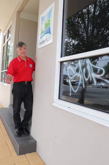 A NEW LOW: The community was outraged on Thursday after Tom Looney of children's cancer charity Country Hope discovered their office had been defaced by graffiti vandals. Picture: Les Smith