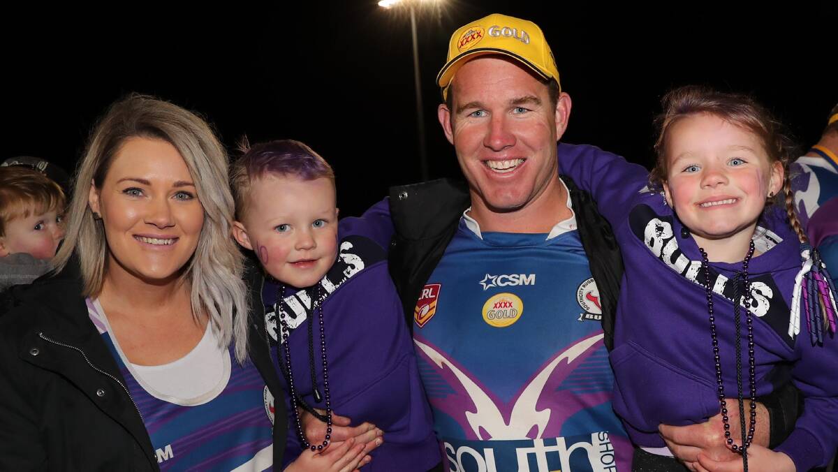 WEIGHING UP PLANS: Southcity front rower Hayden Jeans, pictured with wife Shivawn and their kids Flynn, 3 and Savannah, 5 after the grand final, is considering taking next year off due to a back issue. Picture: Les Smith