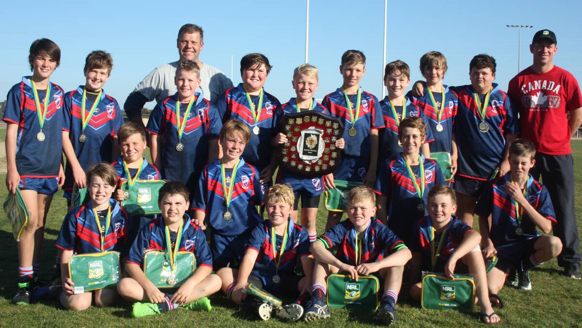 FUN IN THE SUN: Sacred Heart Cootamundra celebrates after taking out the Mortimer Shield following a 12-10 victory over St Marys Young at Parramore Park on Wednesday.