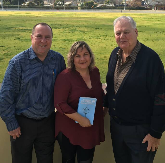 FUNDING HELP: Wagga cricket officials Shaun Perry and Mel Rosengren receive a donation to Wagga Junior Cricket Association from O'Farrell Cup book co-author Brian Lawrence on Thursday. Picture: Courtney Rees