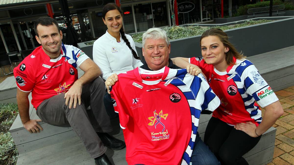 GOOD CAUSE: Nick Gleeson, Kooringal Pharmacy's Sandra Skaf, Peter St Clair and April Sharp with Wagga City's special jumpers. Picture: Les Smith