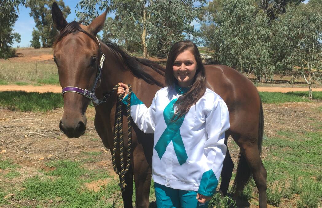 GOOD CAUSE: Ellen Bartley shows off her special colours and pants raising funds for the Women’s Cancer Foundation Ovarian Cancer Institute. Picture: Courtney Rees