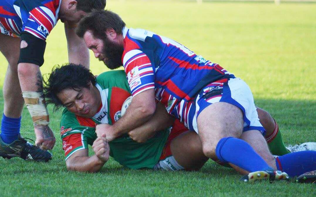 POSTIONAL SWITCH: Young's Warren Aiken, pictured tackling the suspended Sione Nuilia against Brothers this season, will move to five-eighth.