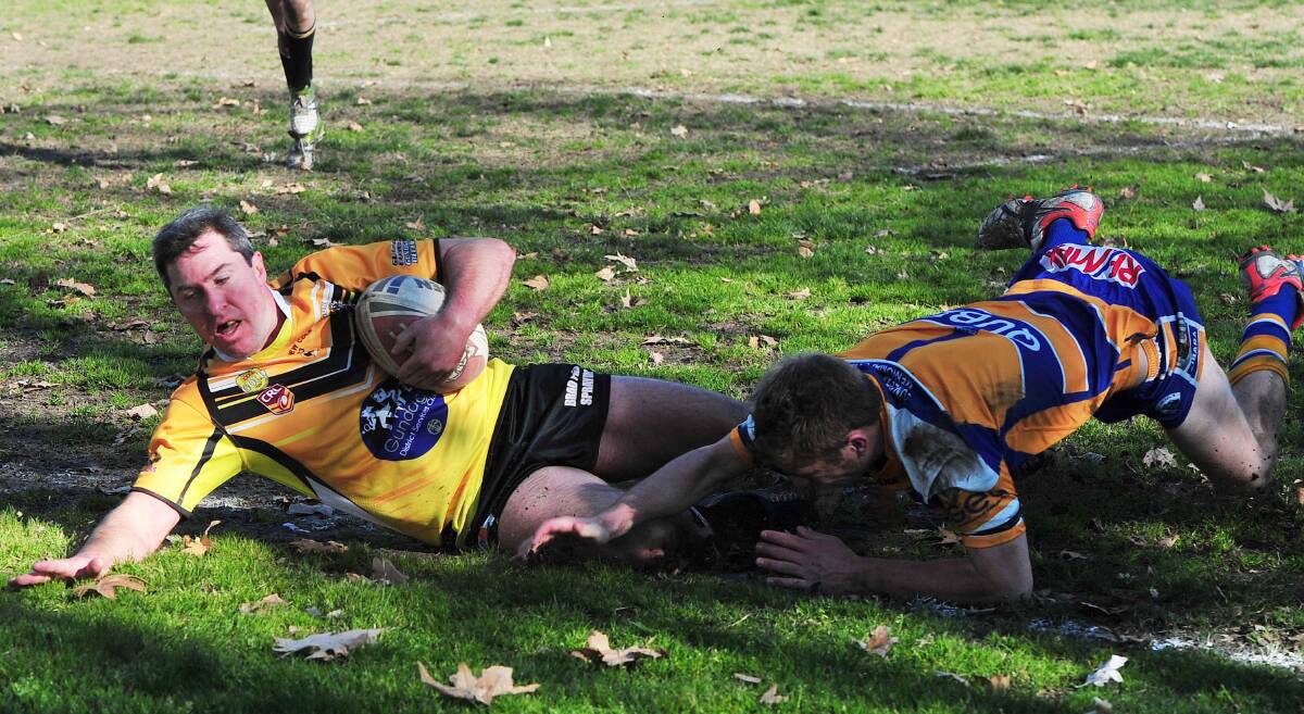 TRY TIME: Gundagai centre Mat Rose slides over to score a crucial first half try against Junee at Anzac Park on Sunday to help book the Tigers' grand final spot. Picture: Kieren L Tilly