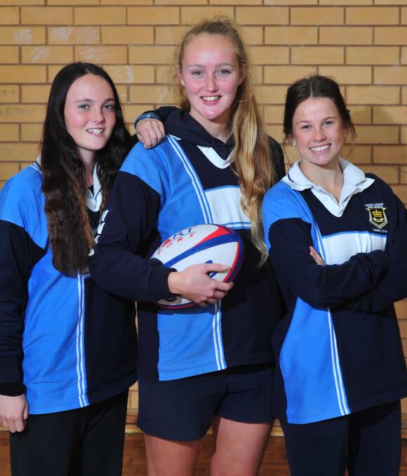 NEW CHALLENGE: Wagga High under 16 captain Bronty Hull (left) and open vice-captain Sarah Hogan and captain Holly Stephens get ready for the NSW CHS state knockout finals in Sydney on Wednesday. Picture: Kieren L Tilly