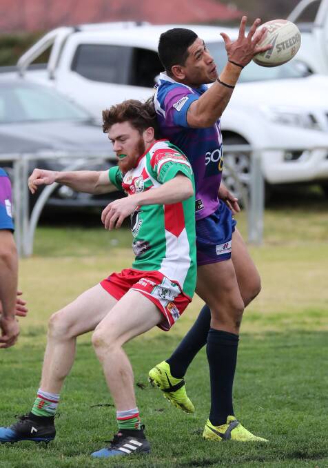 DEMOLITION MAN: Usaia O'Sullivan juggles the ball in a contest with Lachie Harper. The Southcity centre scored a hat-trick in the win over Brothers at Harris Park on Saturday. Picture: Les Smith