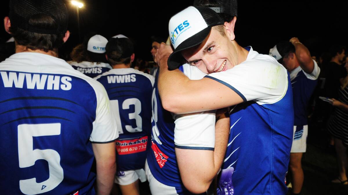 PARTY TIME: Wagga High fullback Steve Senior celebrates with teammate Henry Standley after the Hardy Shield grand final win. Picture: Kieren L Tilly