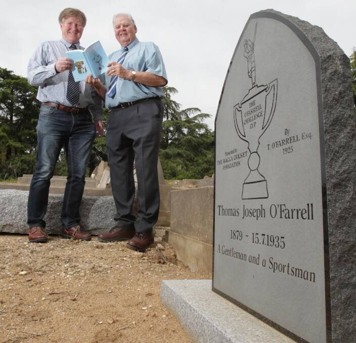 FITTING TRIBUTE: O'Farrell Cup book researcher James Ross and co-author Brian Lawrence at the unveiling of Thomas O'Farrell's headstone, 81 years after his death. Picture: Les Smith