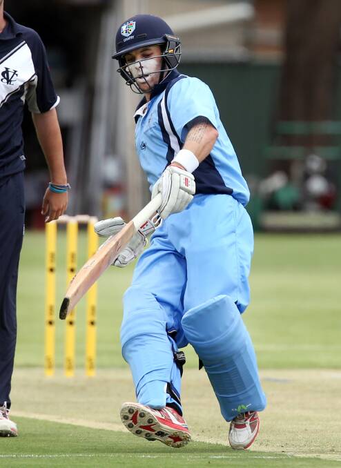 Wagga's Jon Nicoll sliding in for a run while playing for NSW Country.