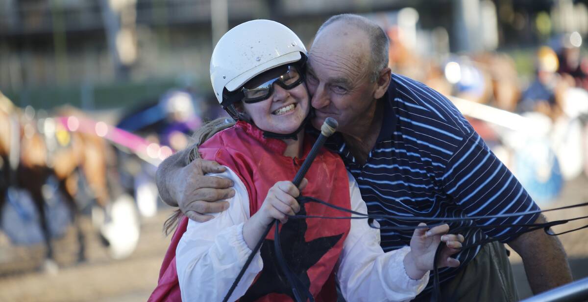 SWEET SUCCESS: Wagga driver Georgia Sutherland is congratulated on her first win by trainer Gary Lang on Tuesday. Picture: Lance Fearne
