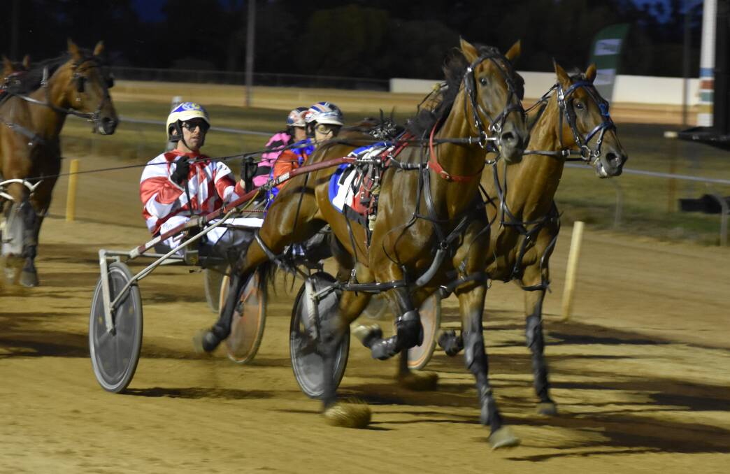 POWERFUL FINISH: Saloon Passage and Cameron Hart claimed the Temora Pacers Cup on Saturday night. Picture: Courtney Rees