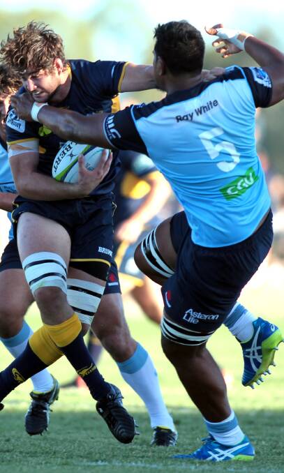 BIG CLASH: ACT Brumbies lock Sam Carter tries to push off his NSW Waratahs counterpart Will Skelton in the Super Rugby trial at Equex Centre on Saturday. Picture: Les Smith