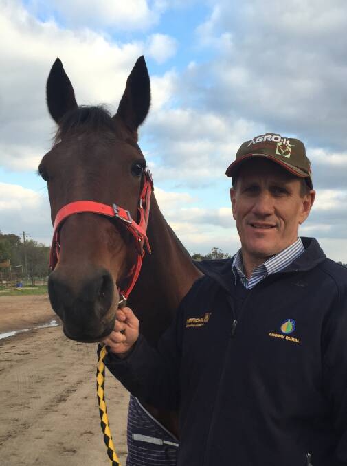 Leeton trainer-driver Chris Hughes with Electric Mary, the mare he'll have his first drive on for almost 20 years.