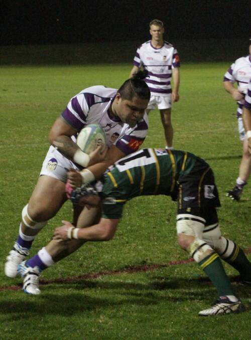 CHARGING AHEAD: Leeton prop Soli Fili looks to push off an Ag College opponent Hamish Pennington in the Phantoms' comfortable 22-0 win on Friday night. Picture: Ron Arel