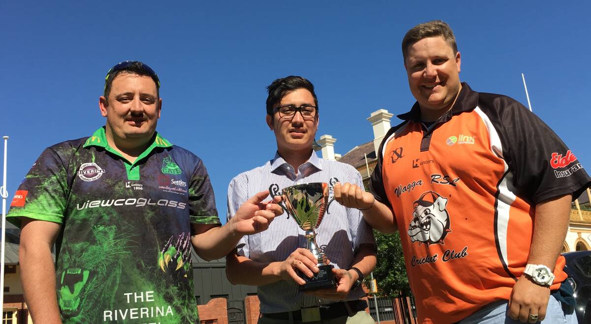 CUP QUEST: Warren Clunes (left) and Todd Henderson (right) are out to get their hands on the Hunters Cup displayed by Scott Payne.