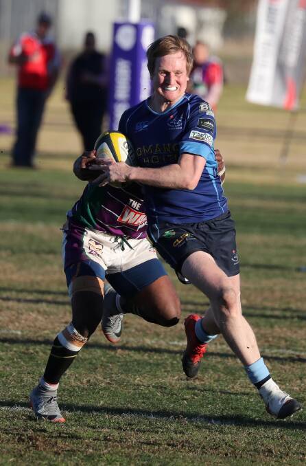 IN SPACE: Dan Selmes makes a break late in the game before going on to score an important try before Waratahs failed to run down Leeton in the Southern Inland grand final on Saturday. Picture: Les Smith