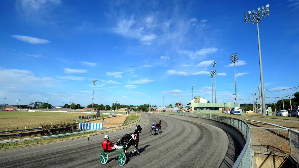 DAYS ARE NUMBERED: Horses warm up for the first at Wagga on Tuesday but the new harness racing track should be ready in February 2018.