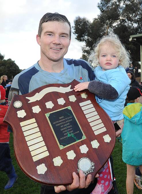 Sean Kearns and daughter Freya, 2, after picking up man of the match honours.