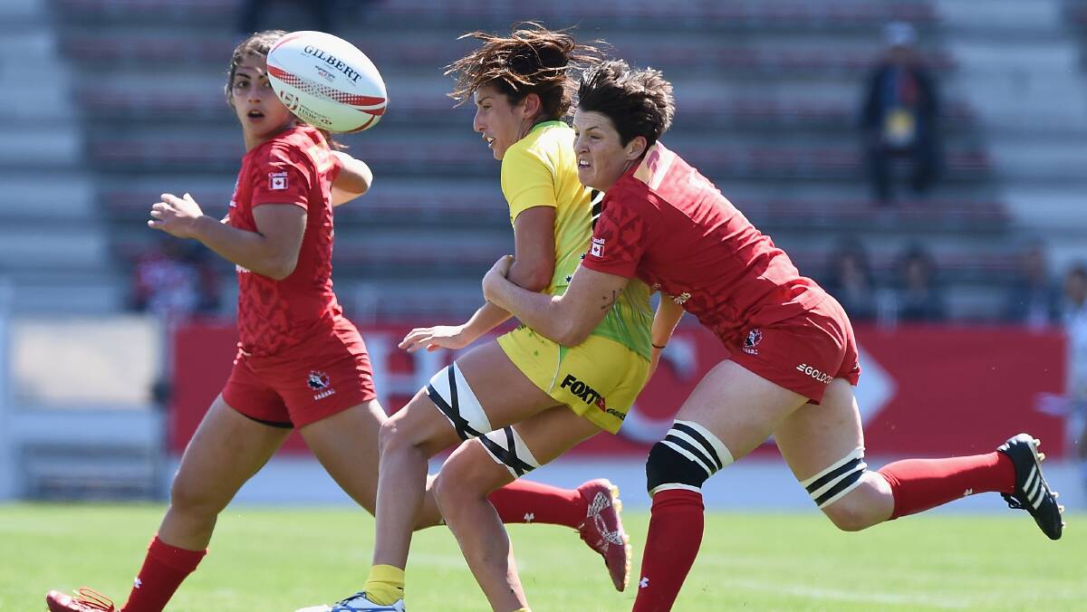 Wagga's Alicia Quirk gets a ball away in the heavy loss to Canada in Kitakyushu.