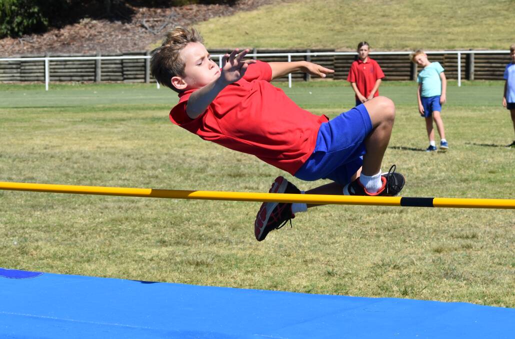 GETTING AIR: Patrick Fitzgibbon sails over the bar during the 11 years boys high jump at the Henschke Primary School athletics carnival at Jubilee on Tuesday. Picture: Courtney Rees