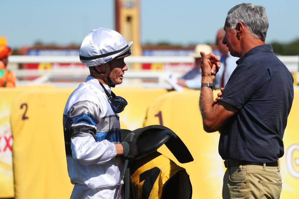 WINNING COMBINATION: Jockey Mathew Cahill and Albury trainer Ron Stubbs discuss Spunlago's win in the Ted Ryder Cup at Murrumbidgee Turf Club on Monday. Picture: Emma Hillier