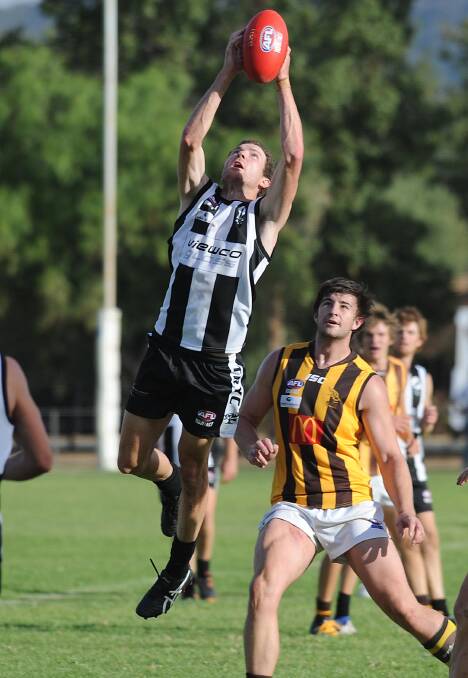 SAFE HANDS: The Rock-Yerong Creek co-coach Andrew Clarke takes a mark in his first game for the Magpies against East Wagga-Kooringal at Victoria Park on Saturday.