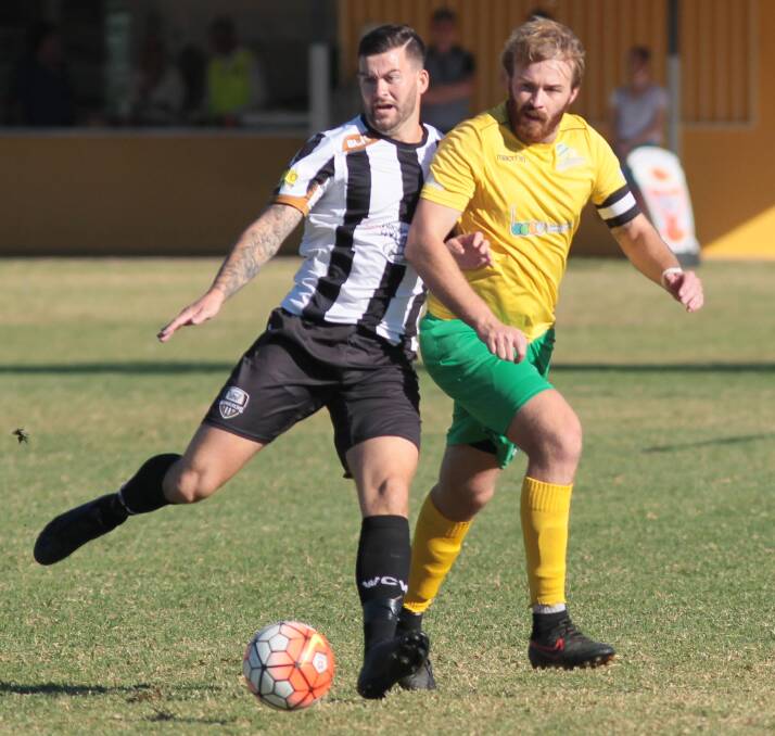  Daniel Maclennan battles for the ball in the Wanderers loss to Bankstown FC last week.