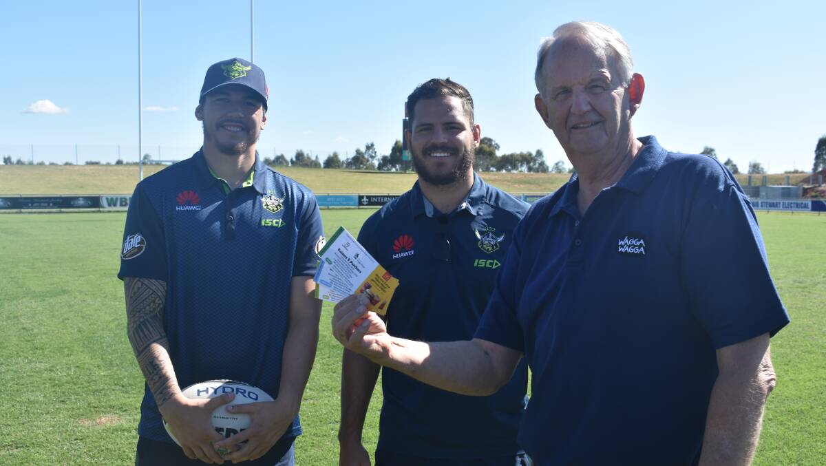 UP FOR GRABS: Canberra Raiders players Brad Abbey and Aidan Sezer with Wagga mayor Greg Conkey at Equex Centre on Thursday. Picture: Courtney Rees