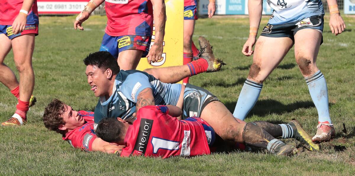TRY TIME: Zac Graham and Tristan Dickson can't stop Gordon Karaitiana from scoring in Tumut's big win on Saturday. Picture: Kieren L Tilly