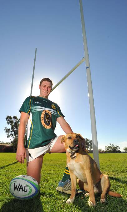 OUT FOR AMENDS: Ag College captain Thomas Macleay, with his dog Pancake, is looking to recover from the 101-point thrashing handed out by Albury last year.
