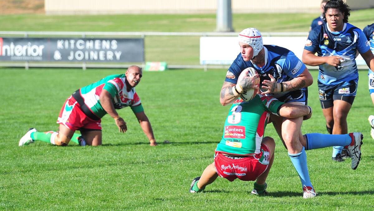 BIG IMPACT: Dan Kilian tries to get an offload away before being tackled by Peter Little in Tumut's big win over Brothers at Equex Centre on Sunday. Picture: Kieren L Tilly