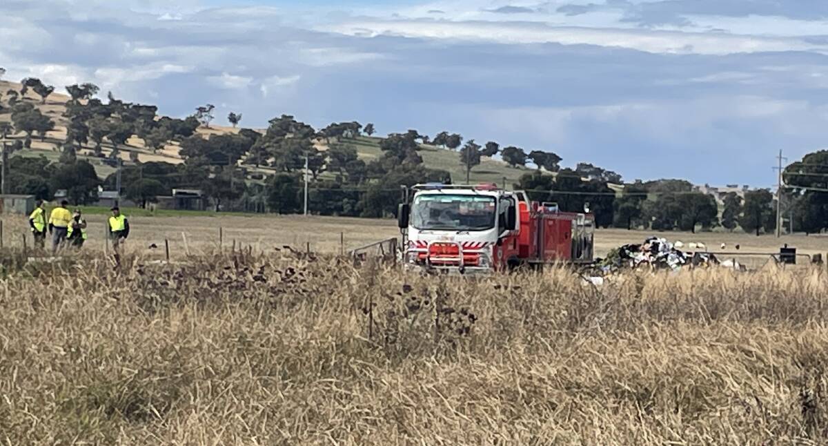 Firefighters on the scene of the garbage truck rubbish fire near the intersection of Parkins Road and Oura Road at Eunanoreenya on Monday, April 29. Picture by Taylor Dodge