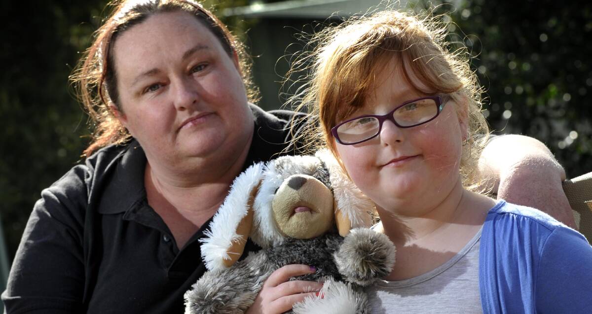 TIME FOR CHANGE: Wagga mum Lizzie Macquarie with daughter Lillian, 8, who suffers from epilepsy. Medical marijuana may be Lillian's best chance of reducing her seizures.