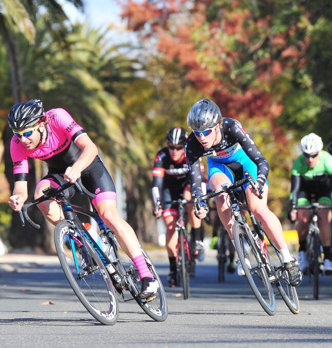 HIGH STAKES: Cyclists fly around the course at the weekend's Wagga Cycle Classic. The parents of a crash victim in the race have praised Wagga hospital.