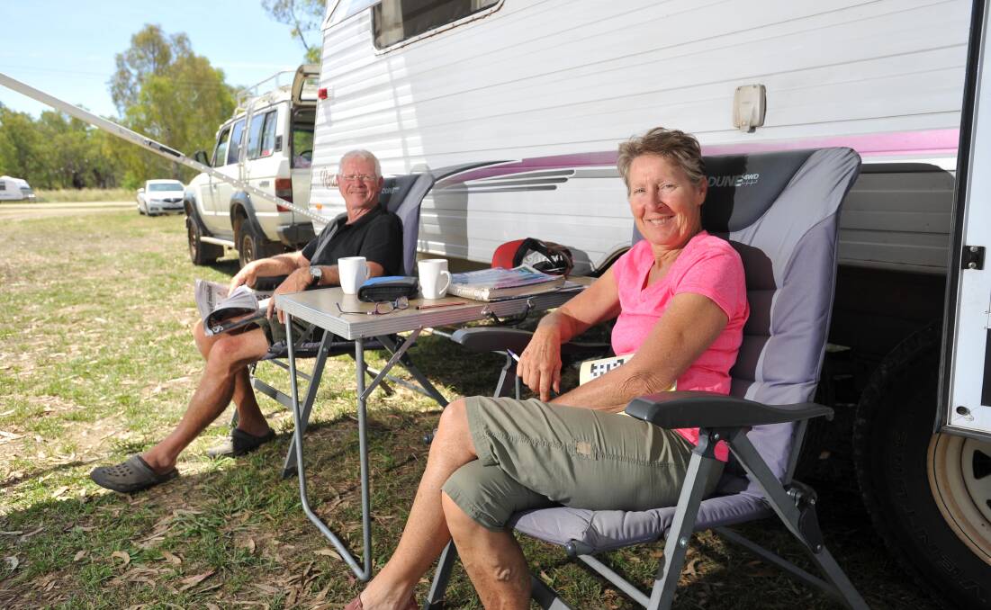 HAPPY CAMPERS: John Carlton and Chris Penketh park their caravan at Wilks Park in North Wagga. The issue of the free camping site has ignited opinion.
