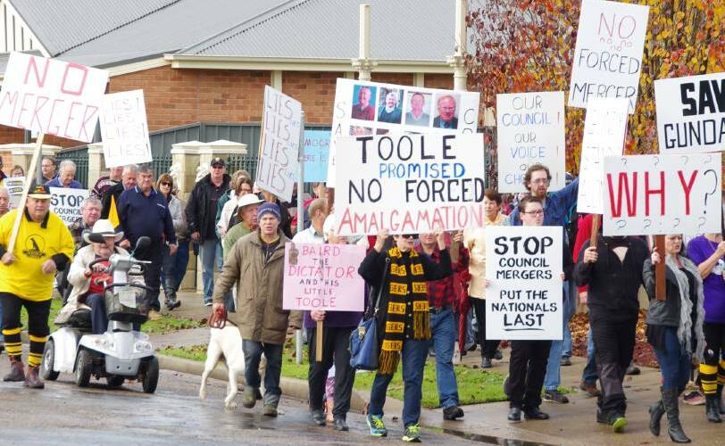 MERGER MADNESS: Gundagai residents march on council to protest forced council mergers. Debate continues to rage about the new council's name.
