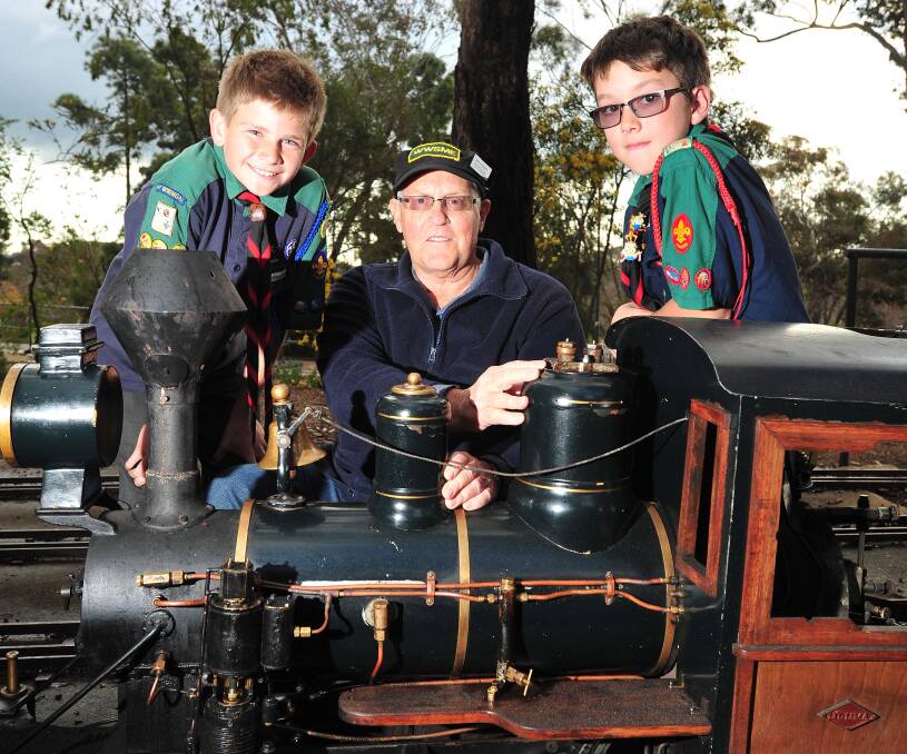STEAMED UP: Getting ready for Sunday's scouts fundraiser are Paddy Carey, 13, Wagga Society of Model Engineers president Jim Weeden and Kael Hetherington, 11.