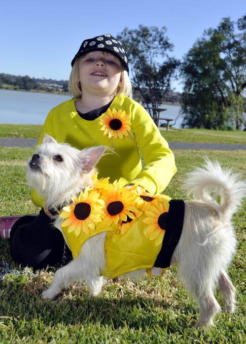 WALK OF LIFE: Joslynne Goodrum, 5, and her trusty pooch at last weekend's Walk to Wellness in Wagga. Organisers of the event have thanked participants and supporters.