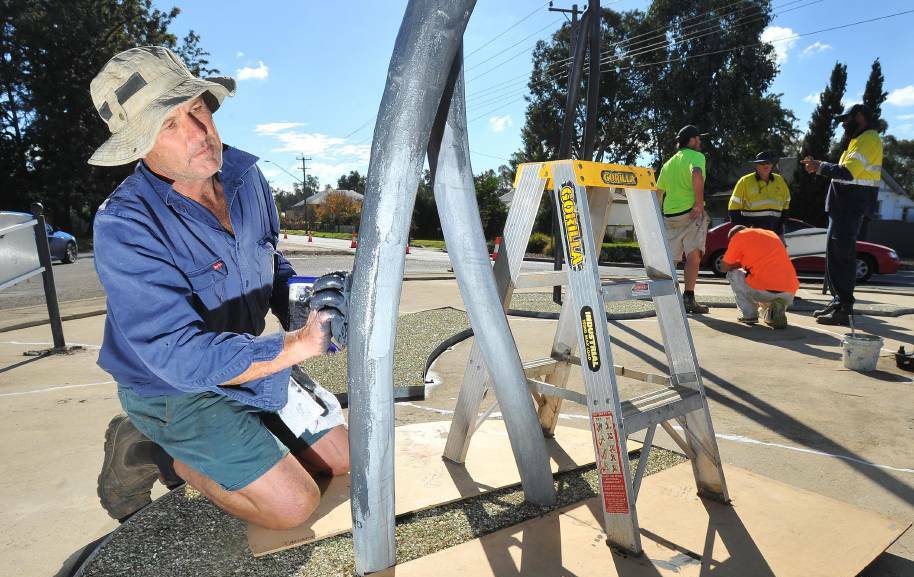STATE OF THE ART: Artistic blacksmith John Wood updating his sculpture, The River. The public art debate continues to rage on the letters page.