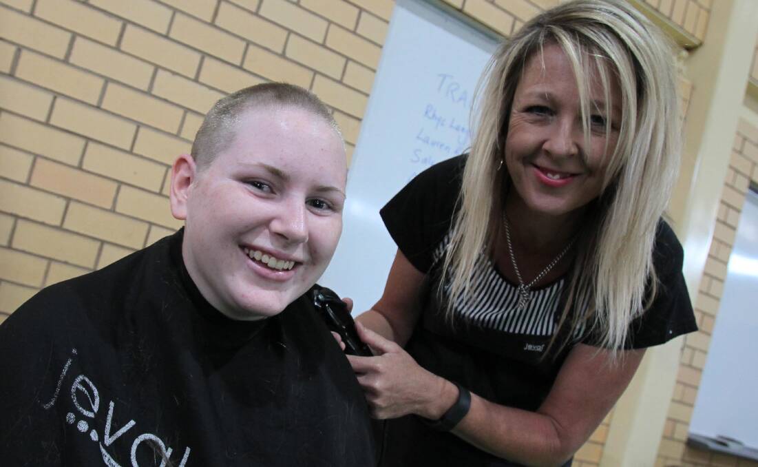 HAIR TODAY, GONE TOMORROW: TRAC student Lauren Roche, 17, with hairdresser Karen Cronk during a World's Greatest Shave event at the school this month.