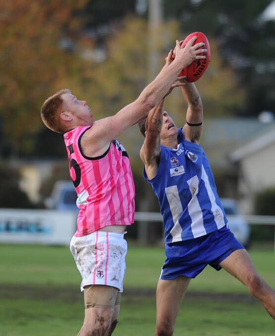 Temora's Josh Sheather, right, in a marking contest with North Wagga's Dave Karlberg. Sheather had been lively in the first half before leaving the field after a head knock. Picture: Laura Hardwick