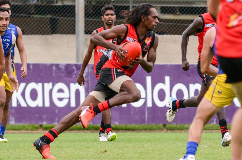 Michael Dunn in action for the Tiwi Bombers. Photo courtesy: Felicity Elliott Photography