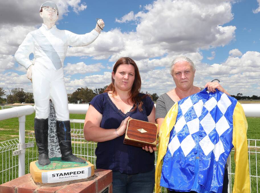  Ellis and Clayton with a box of black armbands and jockeys silks. The pair has also sponsored race three on Monday at Wagga, the Jockeys Memorial Class 1 Handicap.